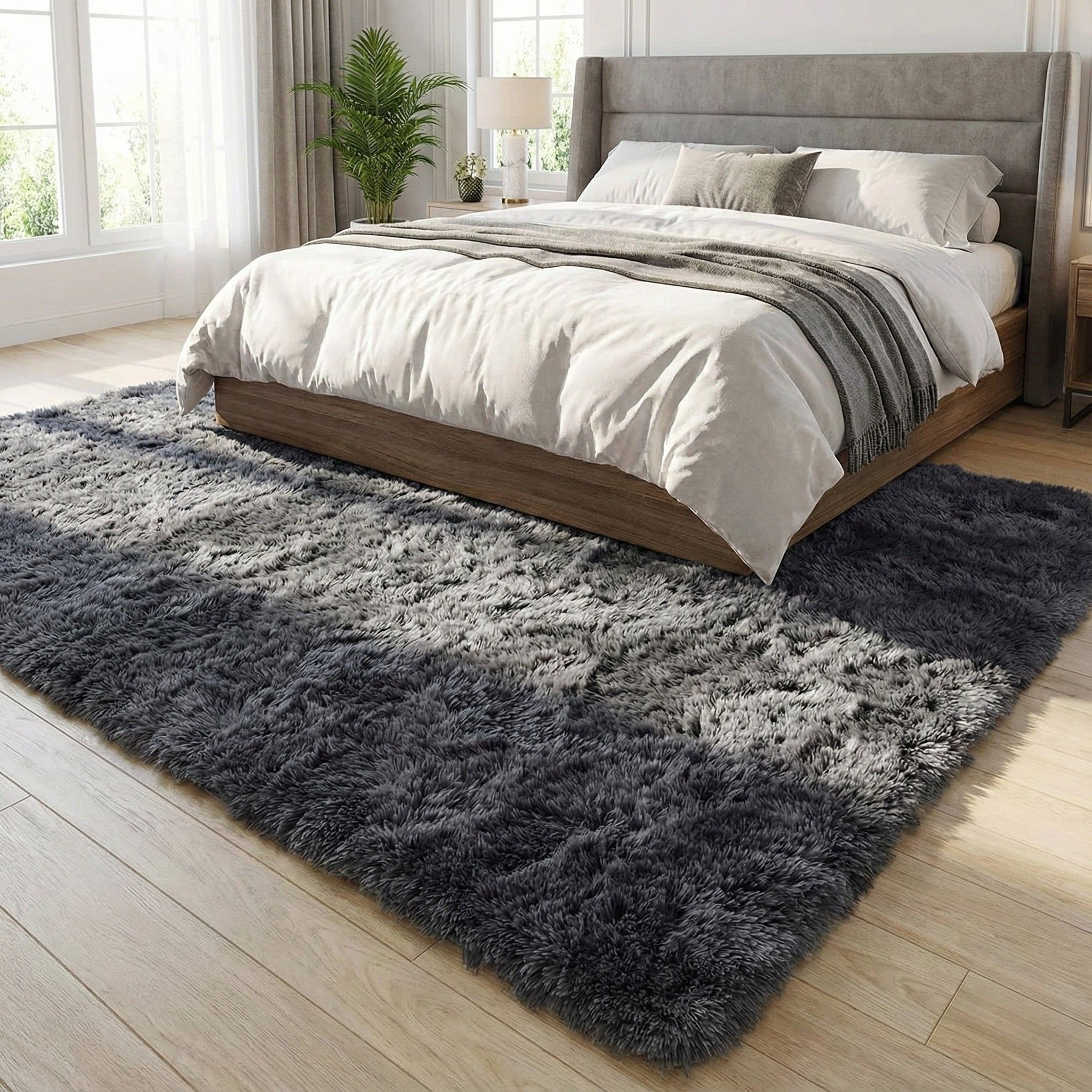 Groot hoogpolig antraciet vloerkleed van 200×240 cm onder een tweepersoonsbed voor een warme, luxe slaapkamerlook.